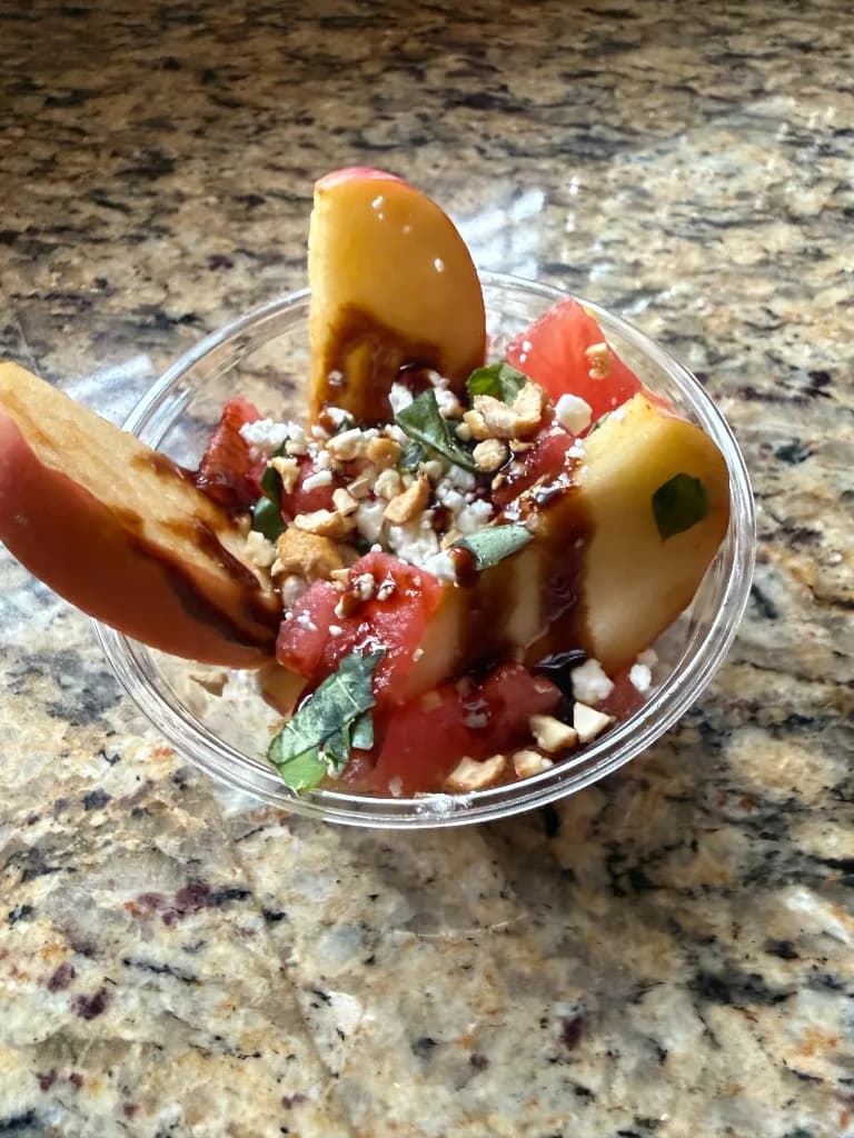 Apple slices with watermelon, feta, fresh basil and a balsamic glaze